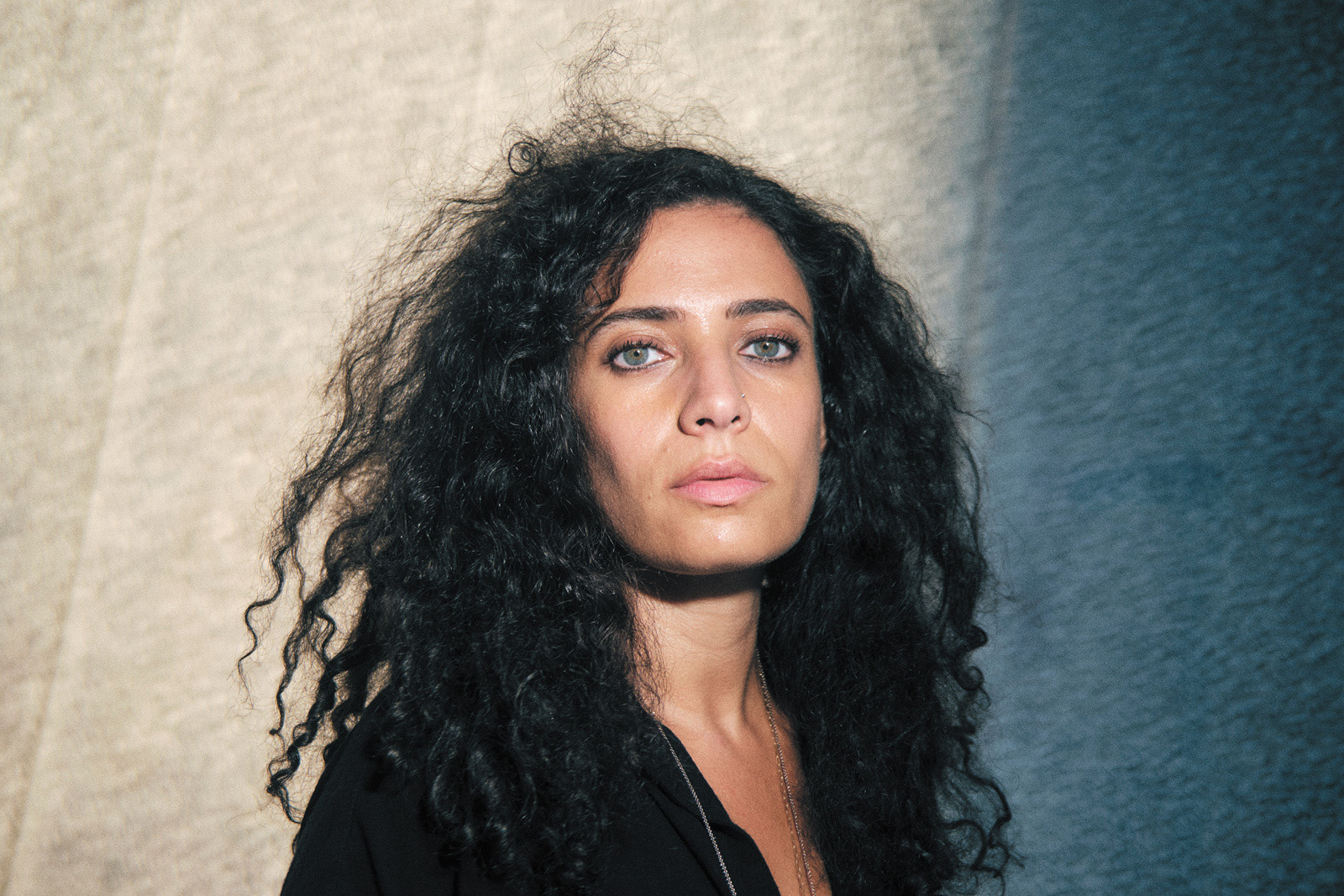 A portrait image of author Hala Alyan