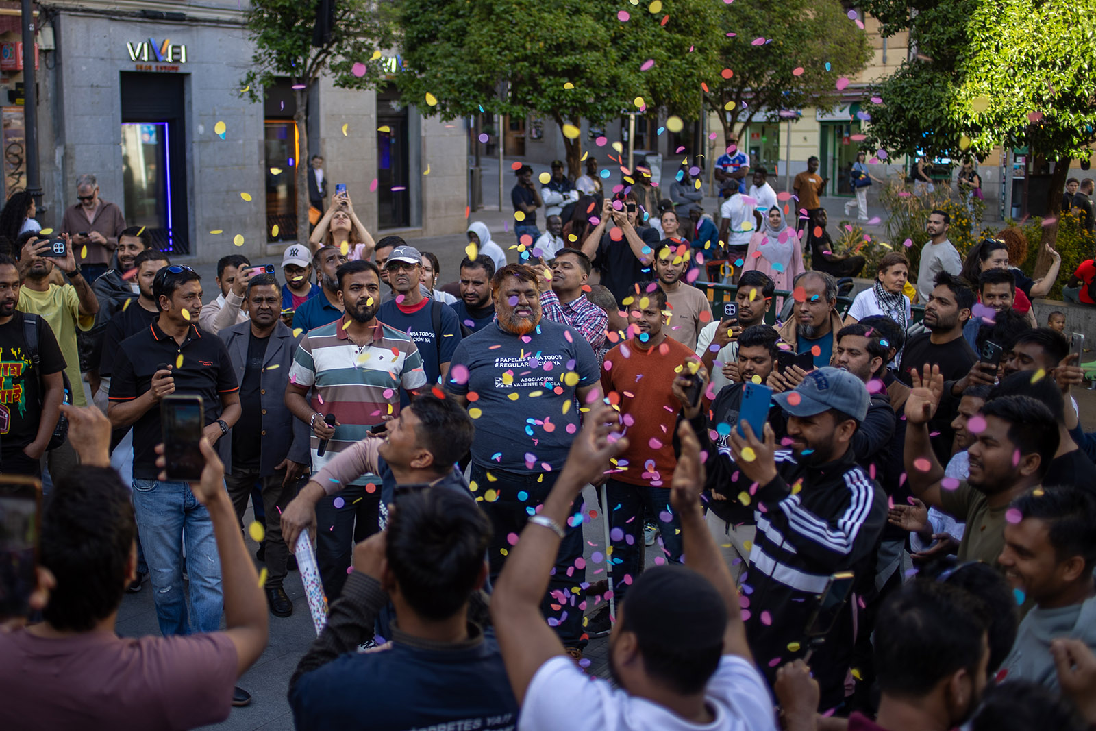 A photograph of a demonstration by migrant and anti-racist campaigners including the Valiente Bangla collective in a street in Madrid, April 2026