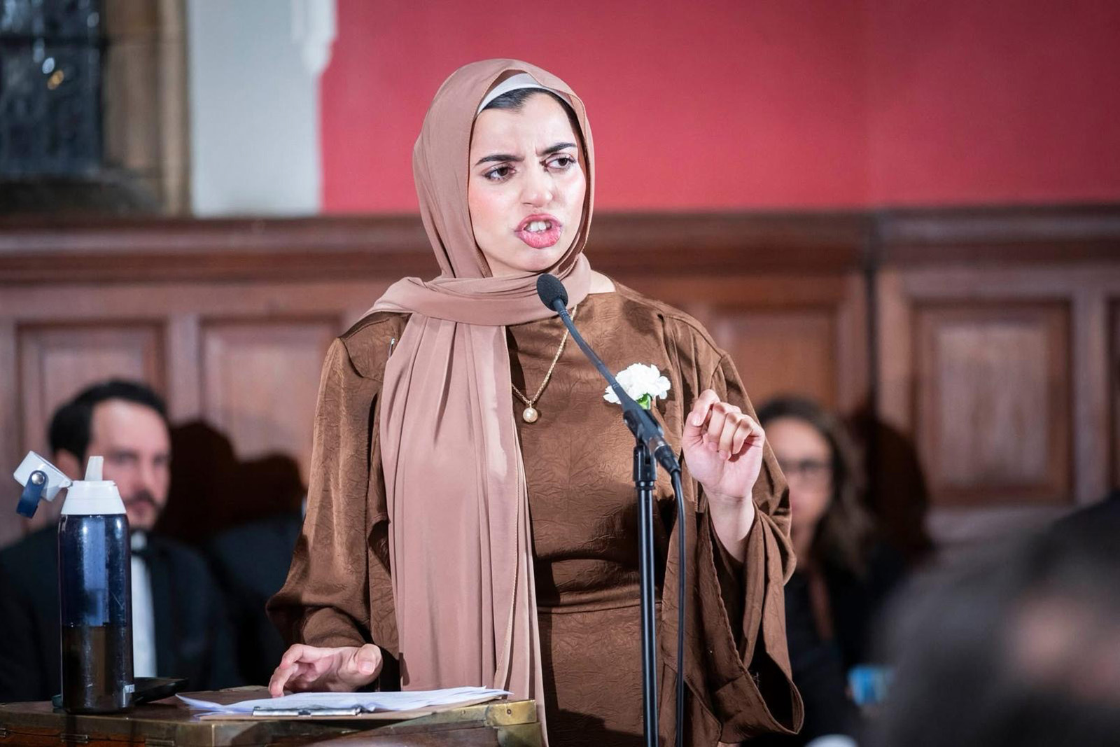 A photograph of Sarah Mughal Rana speaking in a debate at the Oxford Union