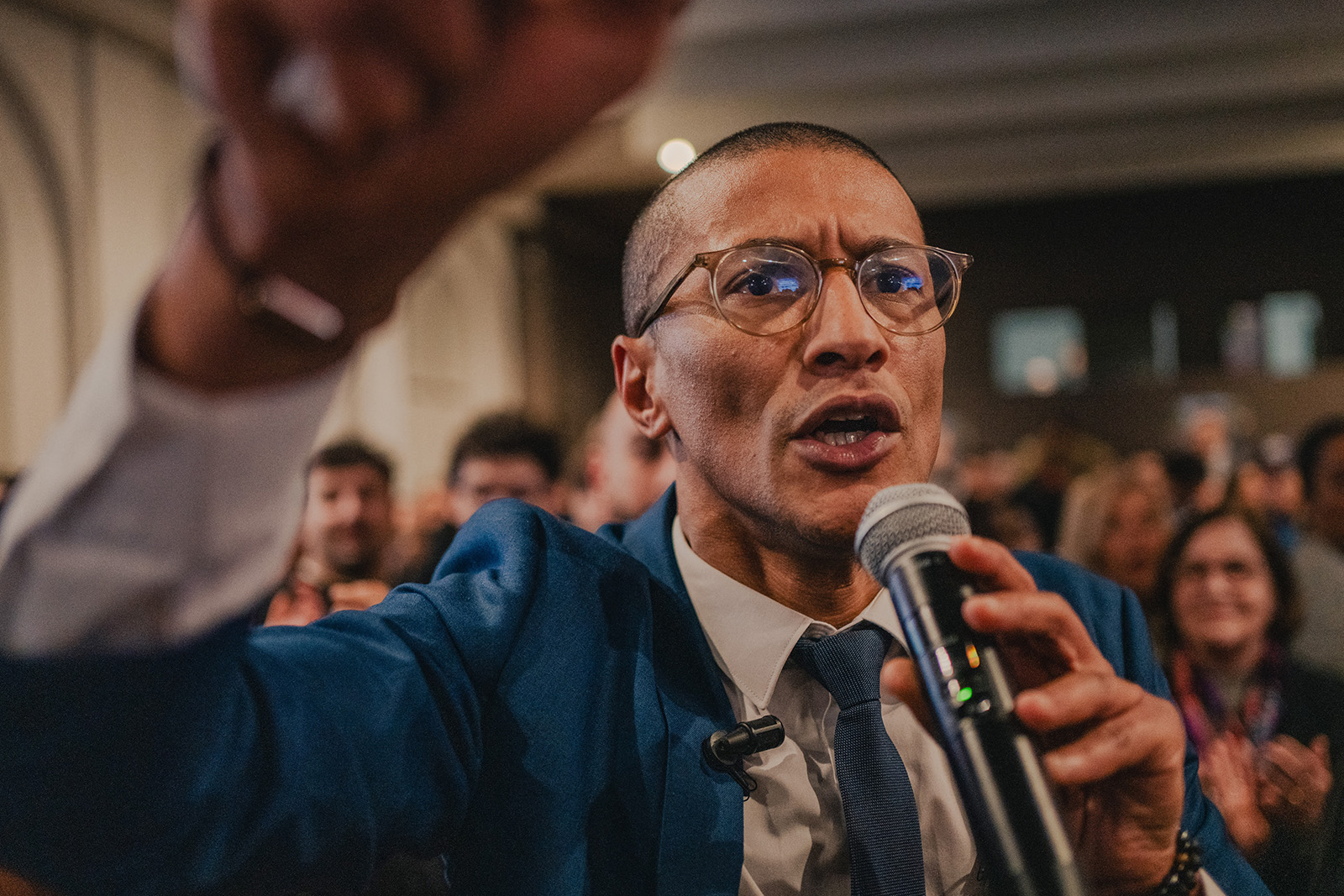 A photograph of Karim Bouamrane speaking to supporters at a campaign event on 12 March 2026, days before he was re-elected as mayor of Saint-Ouen