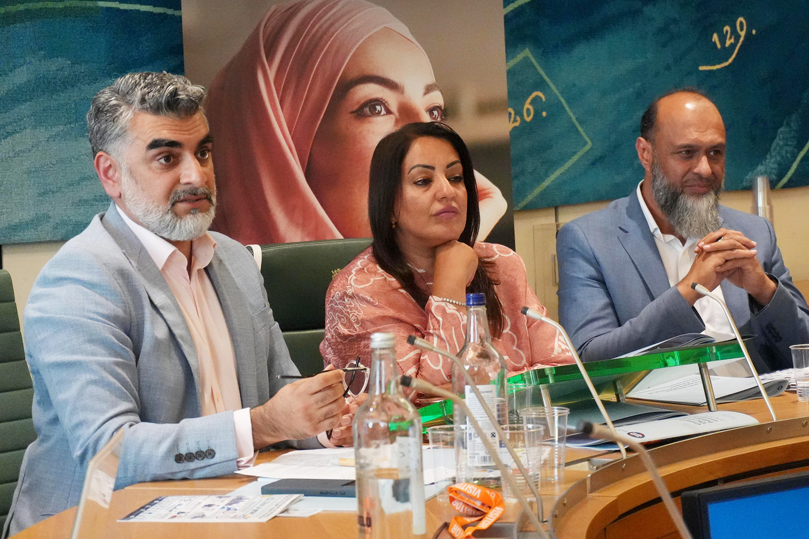 A photograph of Omar Shaikh of the Islamic Finance Council, Naz Shah MP and professor Javed Khan at the Equi event in parliament on 29 June 2026