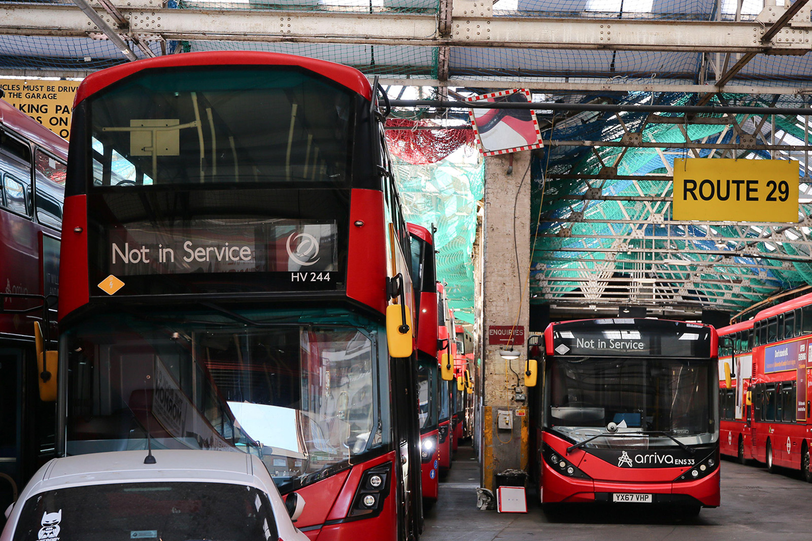 A photograph of red London buses in Wood Green depot, London, one of the Arriva North garages where drivers are taking strike action over extreme heat