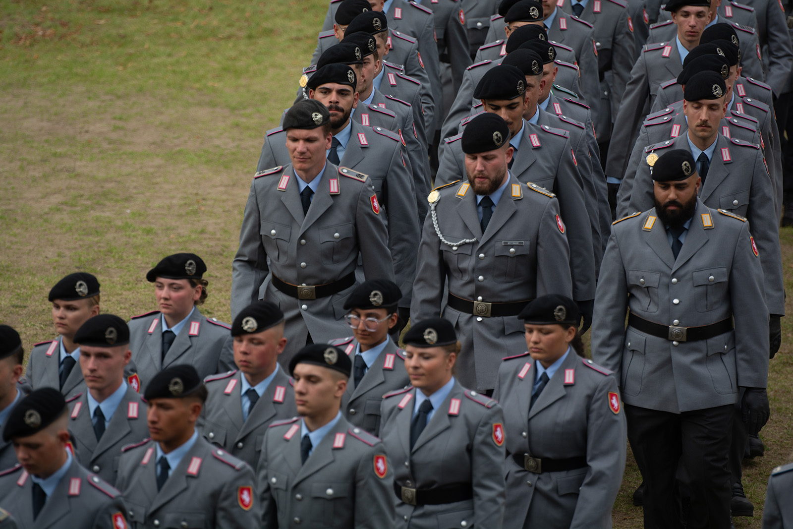 A photograph of new German army recruits marching in formation at a ceremony in Düsseldorf, September 2025