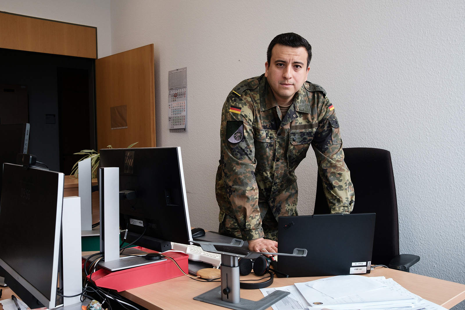 A photograph of captain Halil, in his German army uniform and leaning on a desk, in the Cyber and Information Domain Service offices in Bonn,16 June 2026