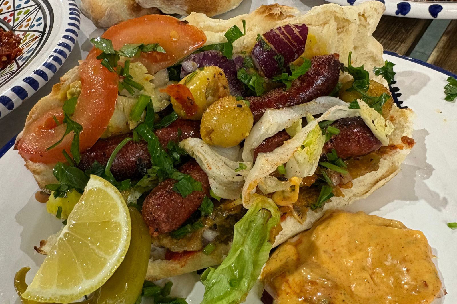 A close-up photograph of a Merguez sandwich from Sweet Saeeda in Kirkgate Market, Leeds