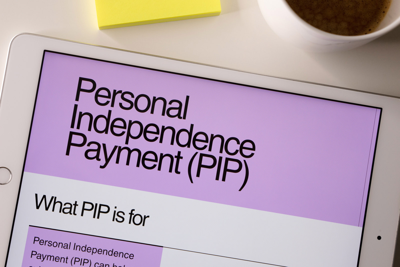 Close up of an iPad with the top of an application form for Personal Independence Payment on it