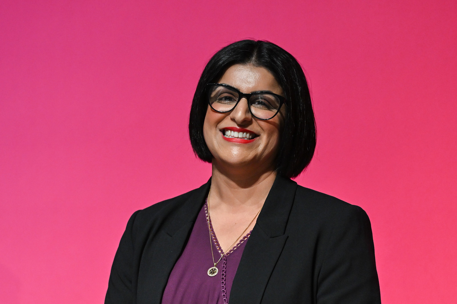 A photograph of a smiling home secretary Shabana Mahmood on stage at the Labour Party conference in Liverpool, 28 September 2026