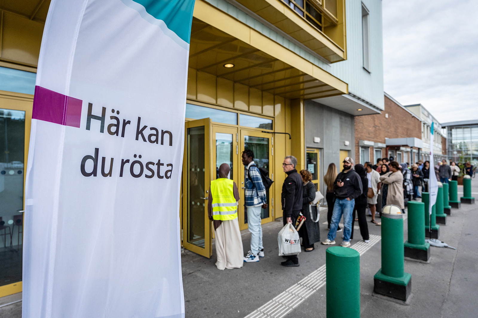A photograph of people queuing to cast an early vote in Sweden's 2026 general election at a Malmö polling station, 11 September