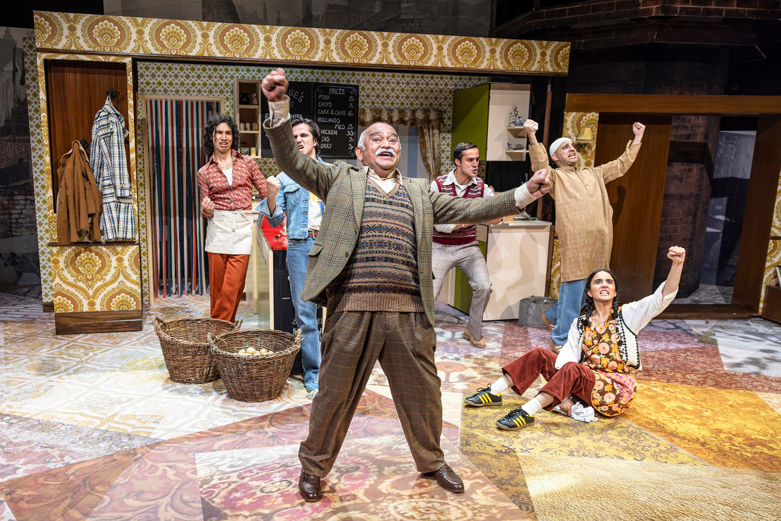 A photograph of the cast of Ayub Khan Din's East Is East on stage performing