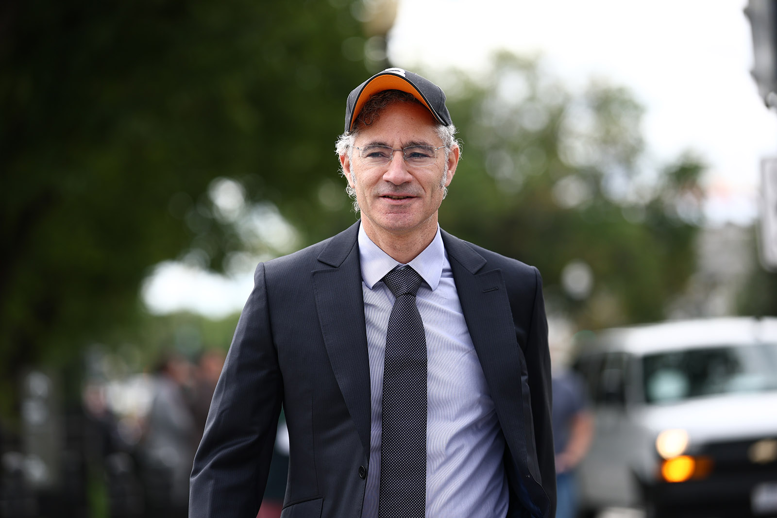 Palantir's Alex Karp, wearing a suit and tie and baseball cap, arriving for a tech CEOs lunch with Donald Trump at the White House, 29 September 2026