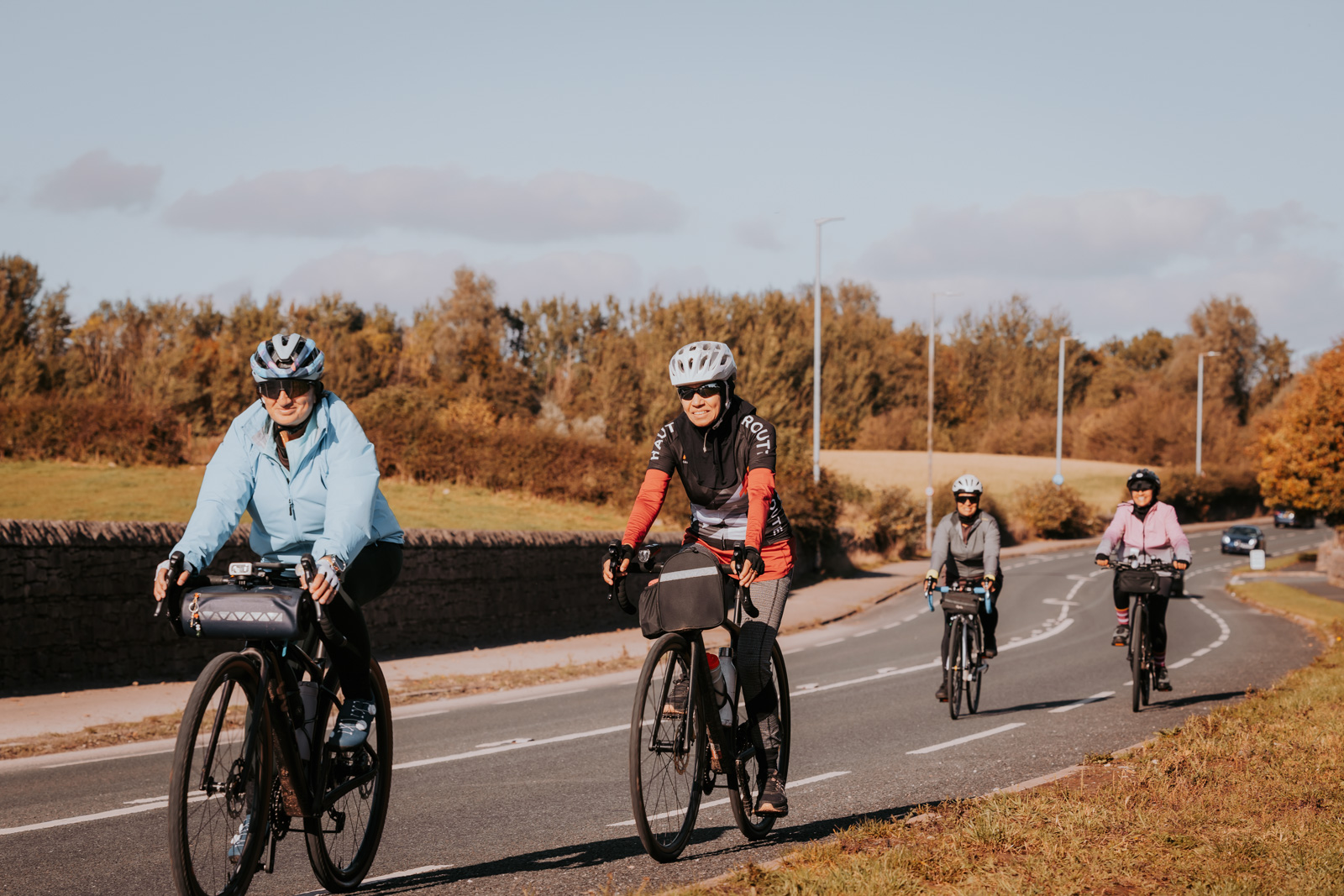 A photograph showing four members of the Spokes Sisters cycling club on a bike ride