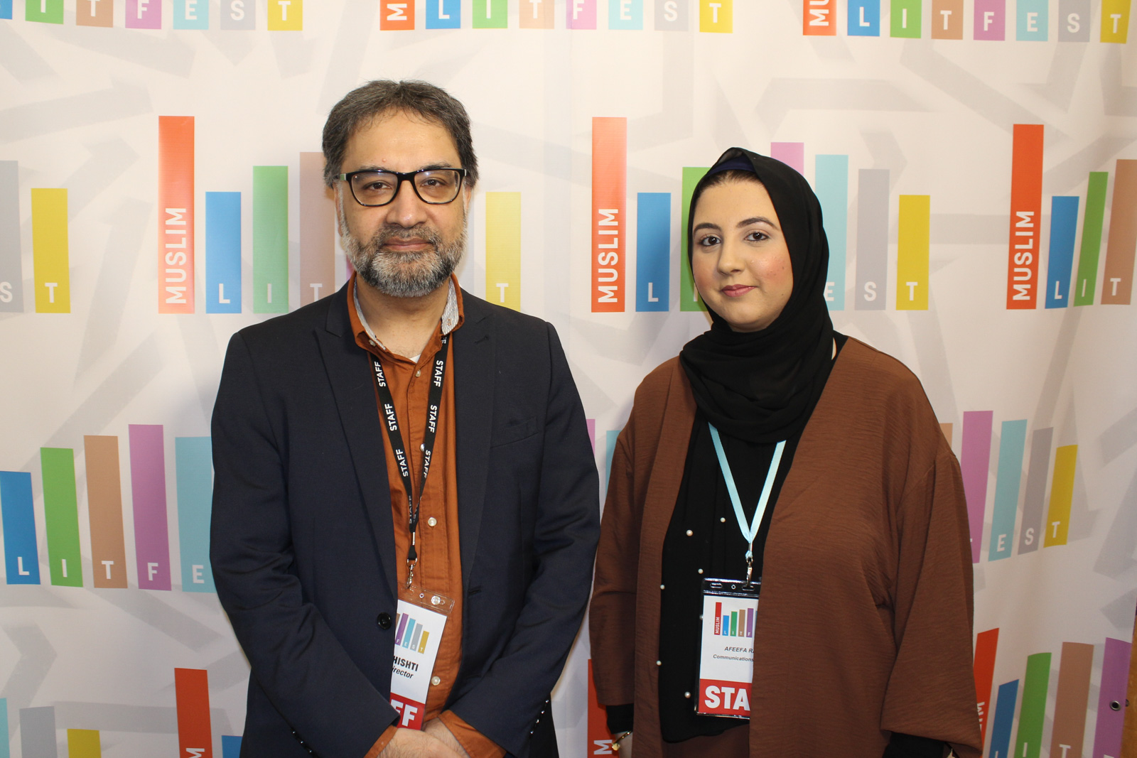A photograph of Jamil Chishti, Beacon Books and Muslim LitFest founder, taken at the event in a previous year, standing with a woman doing the event's PR and communications for a promotional shot