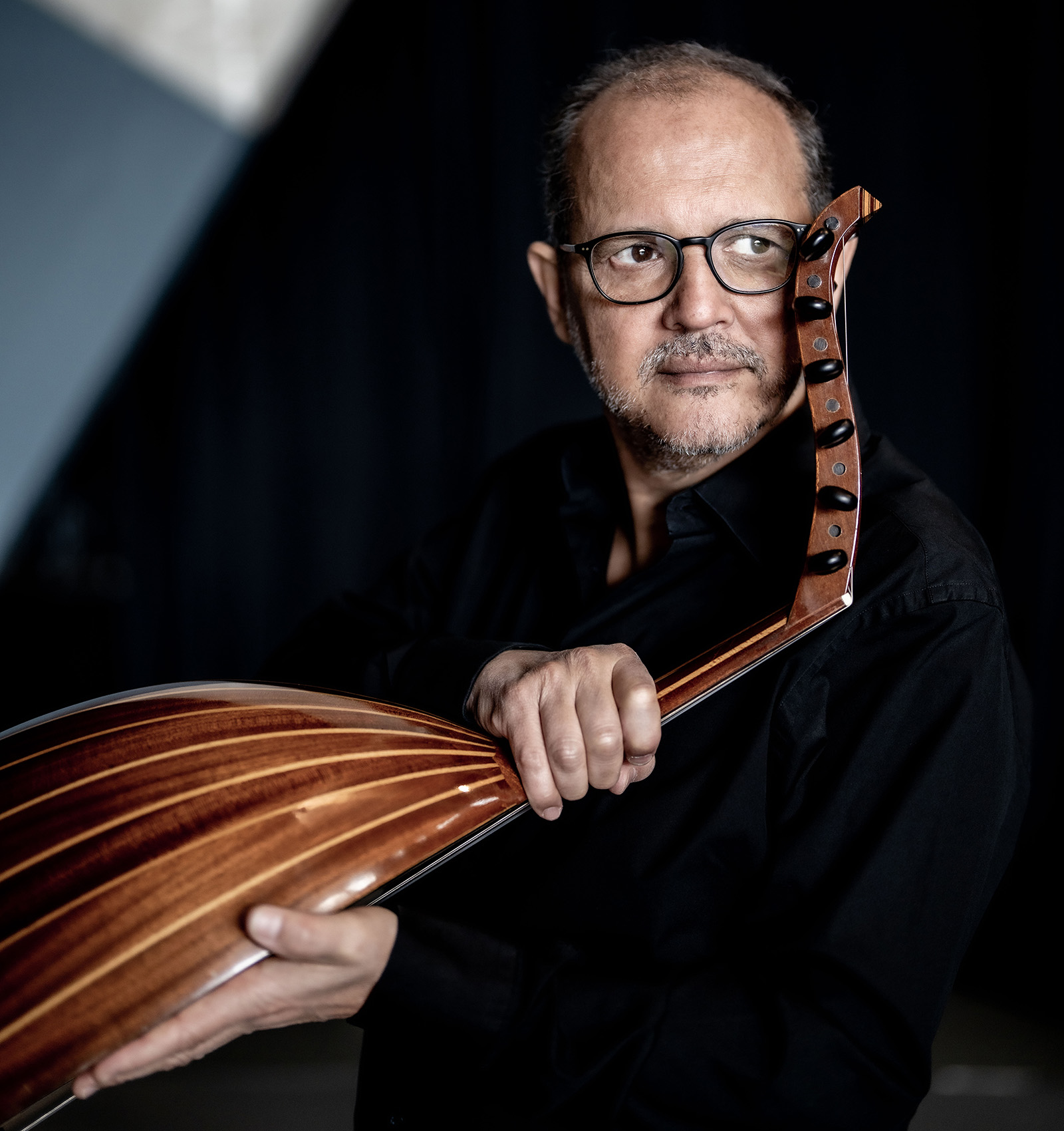 A portrait image of regular London Jazz Festival performer Anouar Brahem holding an oud