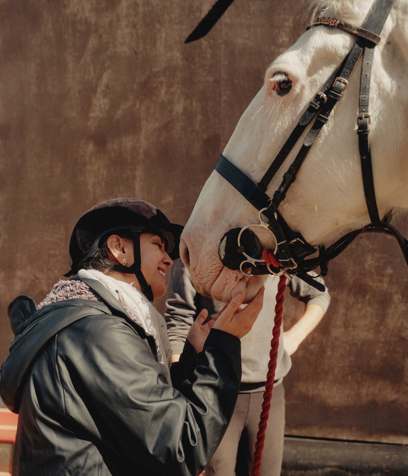 London, United Kingdom, September 12, 2026: One of the participants of Sisters Countryside Club is petting the horse after the ride. Photographed by Tori Ferenc for Hyphen.